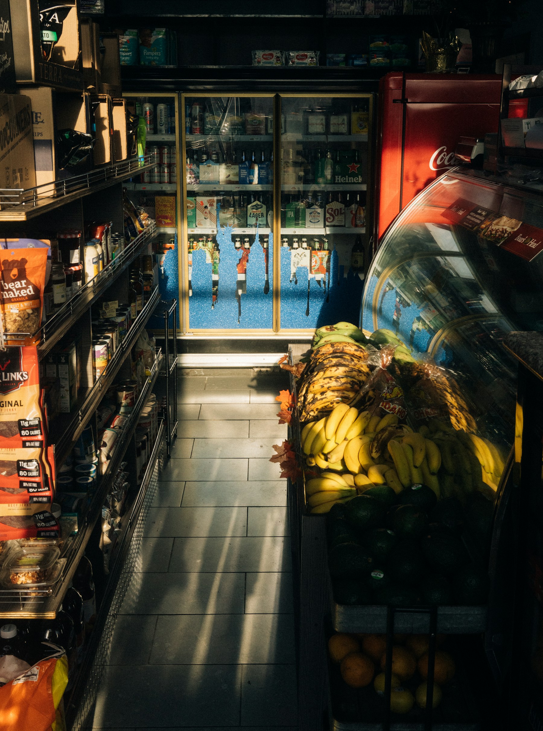Warm afternoon sunlight inside a neighborhood bodega in Bushwick, Brooklyn